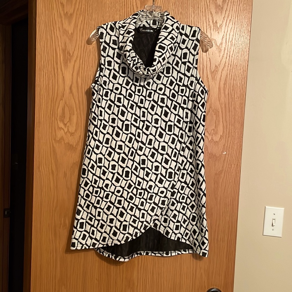 A classic tunic style with cow neck and overlay front